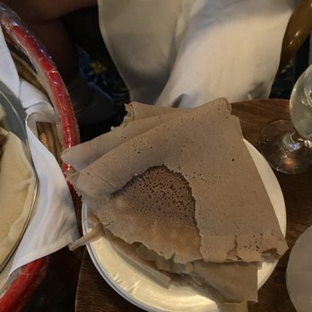 Asmara Restaurant - a plate of pita bread and a glass of wine - Ethiopian Near Me - Cambridge, Massachusetts Asmara Restaurant - a plate of pita bread and a glass of wine - Ethiopian Near Me - Cambridge, Massachusetts