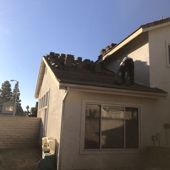 AAA Roofing Services - Lifting all the tiles to replace all the 20 year old felt/tar lining - Roofing Near Me - Calabasas, California
