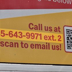 McDonald's - Phone number has changed sticker on drive-thru window.