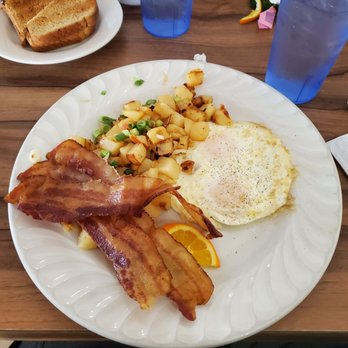 The Palms Cafe - Bacon and eggs country potatoes and wheat toast. - Breakfast & Brunch Near Me - Rancho Mirage, California The Palms Cafe - Bacon and eggs country potatoes and wheat toast. - Breakfast & Brunch Near Me - Rancho Mirage, California