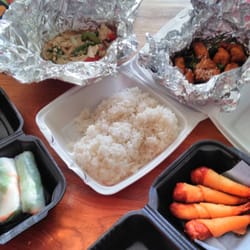 Aroi Thai Cuisine - Shrimp Spring Rolls, Shrimp in the Blanket, Basil Fried Rice, and Sesame Chicken.