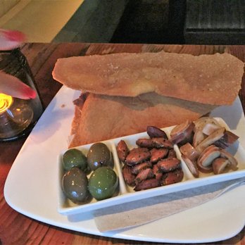 Oenotri - Part of Salumi order - Large crackers, olives, seasoned almonds and marinated mushrooms - Italian Near Me - Napa, California