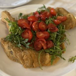 Nerino Dieci - Milanese Veal Cutlet with Rocket and Cherry Tomatoes
