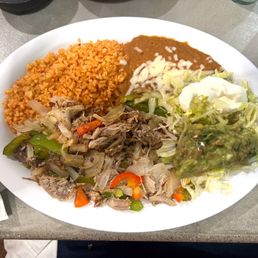 Fajita platter with pork carnitas. Fajita platter with pork carnitas.