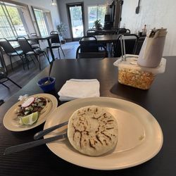 Asada taco and chicharrón con queso pupusa
