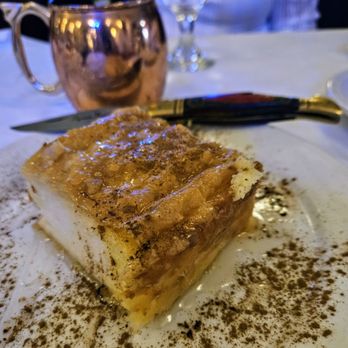 The Great Greek - Galaktobouriko: Lightly sweet, springy, warm egg custard, sprinkle of cinnamon, leathery, filo dough base - Greek Near Me - Sherman Oaks, California The Great Greek - Galaktobouriko: Lightly sweet, springy, warm egg custard, sprinkle of cinnamon, leathery, filo dough base - Greek Near Me - Sherman Oaks, California