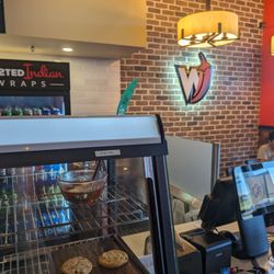 Twisted Indian Wraps - Logo on the wall
