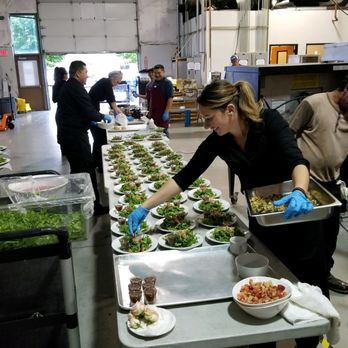 The WaitStaff Team - Our staff plating up salads for a large dinner. - Party & Event Planning Near Me - Tigard, Oregon The WaitStaff Team - Our staff plating up salads for a large dinner. - Party & Event Planning Near Me - Tigard, Oregon