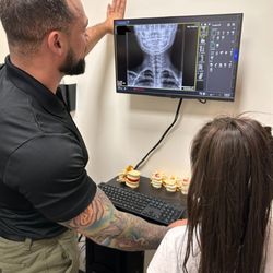 Chiro Studio - Dr. Junior at Chiro Studio in Cocoa, FL analyzing the x-ray of a new patient.