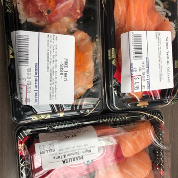 Maruta Shoten - Salmon sashimi, tuna and salmon nigiri, and inari stuffed with salmon and tuna poke. - Delis Near Me - Seattle, Washington Maruta Shoten - Salmon sashimi, tuna and salmon nigiri, and inari stuffed with salmon and tuna poke. - Delis Near Me - Seattle, Washington