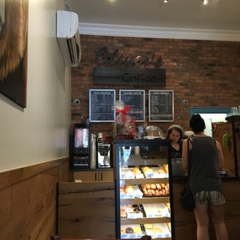 Oliver's Coffee - a woman standing in front of the counter - Cafes Near Me - Muskoka Lakes, Ontario Oliver's Coffee - a woman standing in front of the counter - Cafes Near Me - Muskoka Lakes, Ontario
