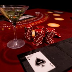 Red Door Escape Room - Cash Me If You Can chips and clue on the table.