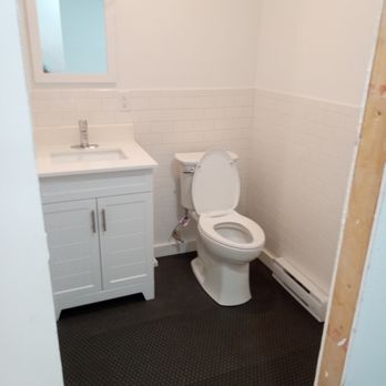 Jax Snow Electric and Construction - a toilet and sink - Electricians Near Me - Peru, New York Jax Snow Electric and Construction - a toilet and sink - Electricians Near Me - Peru, New York