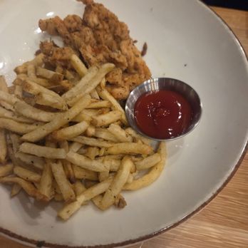 Cork & Pig Tavern - Kid's chicken tenders. The chicken tenders were excellent. The fries were barely touched. - New American Near Me - Abilene, Texas