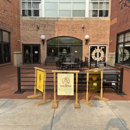 Patio area outdoors and seating inside as well.