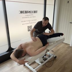 John Miller Osteopathy - John using a long lever fascial stretch on a client.
