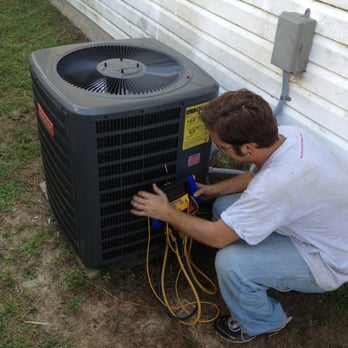 Absolute Clean Hvac - Technician performing AC Check Up by Absolute Clean HVAC - Heating & Air Conditioning/HVAC Near Me - Pensacola, Florida