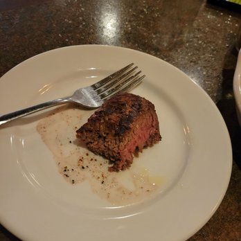 Casa Calabria - Filet on bread plate, one bite taken... - Pizza Near Me - Marquette, Michigan