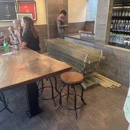 Shelves in front of the pick up counter and someone else being ignored for 20 min. Shelves in front of the pick up counter and someone else being ignored for 20 min.