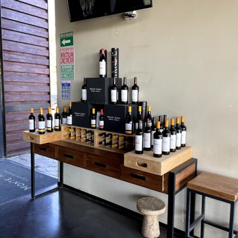 Monte Xanic - wine bottles on display - Wine Bars Near Me - Ensenada, BCN