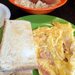 Set D: luncheon meat noodles with butter toast + ham & omelette as sides incl. of 1 drink of your choice: $10