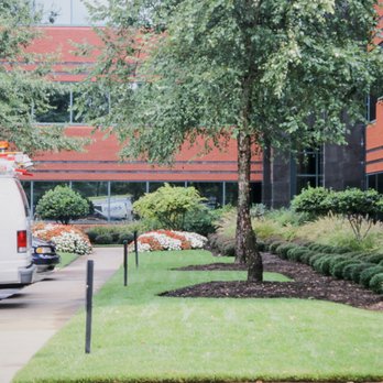 St. George Landscape Design - a van parked in front of a building - Landscaping Near Me St. George Landscape Design - a van parked in front of a building - Landscaping Near Me
