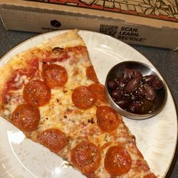 Michaelangelo's Pizza - Pepperoni giant slice with a side of olives! So YUM
