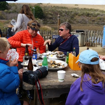 Hog Island Oyster - Table sharing and kids actually doing something other than playing on their I-pads.  A warming thought. - Seafood Near Me - Marshall, California