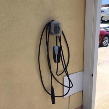 Curtis Larson - This is a 50 amp Tesla car charger located outside of the garage but behind the gate - Electricians Near Me - Huntington Beach, California Curtis Larson - This is a 50 amp Tesla car charger located outside of the garage but behind the gate - Electricians Near Me - Huntington Beach, California