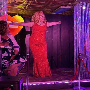 Eureka Live - a woman in a red dress on stage - Dance Clubs Near Me - Eureka Springs, Arkansas Eureka Live - a woman in a red dress on stage - Dance Clubs Near Me - Eureka Springs, Arkansas