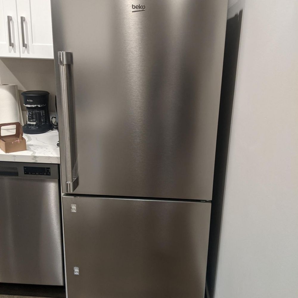Right Water Damage - The fridge's freezer door with handle coming off - Damage Restoration Near Me Right Water Damage - The fridge's freezer door with handle coming off - Damage Restoration Near Me