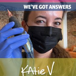 Katie V Studio - Katie V. holding up a tattoo pen.