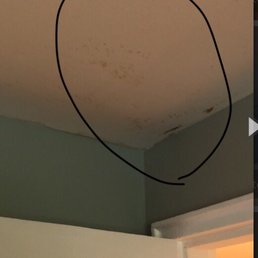 Water soaking through the ceiling as a result of no drain pan in the AC unit.