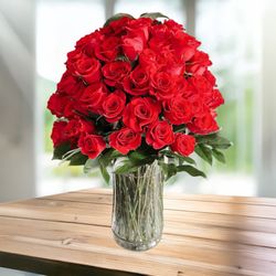 De's Flowers - Make it extra special this Valentines Day with 6 dozens of our Lux Roses. Each bloom is given individual stunning placement in a glass vase.