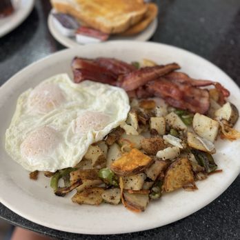 Kamilas Breakfast and Lunch - Eggs bacon and breakfast potatoes. Everything was well cooked. Eggs over easy. - American Near Me - San Diego, California Kamilas Breakfast and Lunch - Eggs bacon and breakfast potatoes. Everything was well cooked. Eggs over easy. - American Near Me - San Diego, California