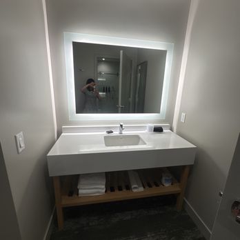 Olivia Hotel - The bathroom sink area I like the lighted mirror and the modern faucet. - Hotels Near Me - Los Angeles, California