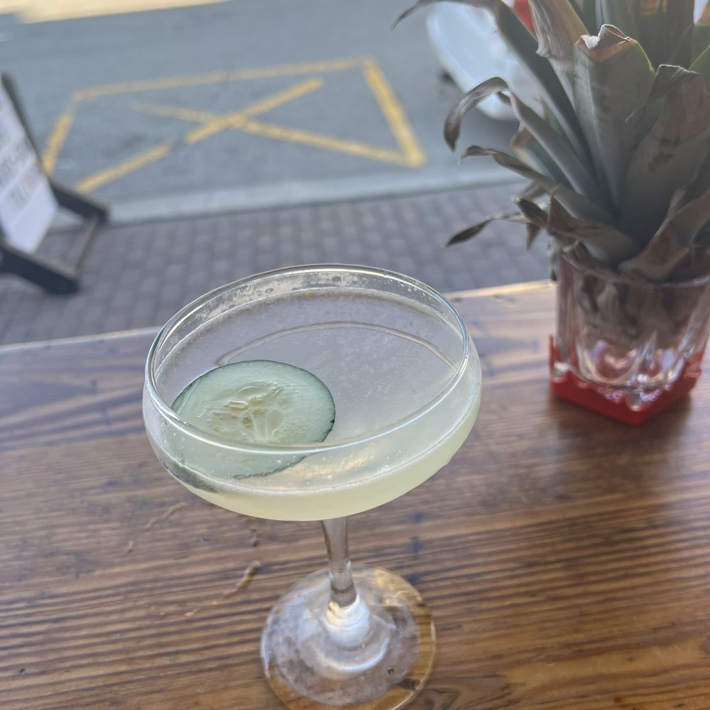 a pineapple and cucumber cocktail a pineapple and cucumber cocktail