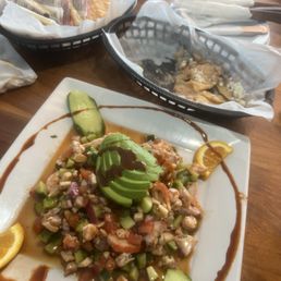 Seafood tostada. What's left of the chips with beans. Yum Seafood tostada. What's left of the chips with beans. Yum