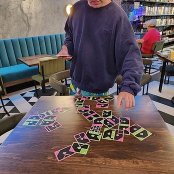 The Boarding Home - Card game is played kind of like dominoes. - Themed Cafes Near Me - Carlsbad, California
