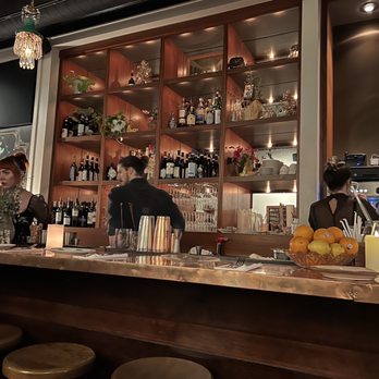 Uliveto - a bar with people sitting at it - Mediterranean Near Me - Richmond, Virginia