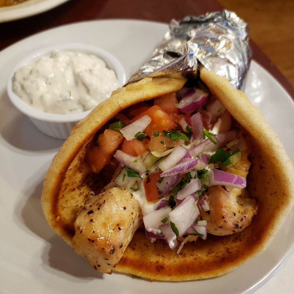 Samos Restaurant - Grilled chicken pita with onions, tomatoes and tzatziki - Greek Near Me - Baltimore, Maryland Samos Restaurant - Grilled chicken pita with onions, tomatoes and tzatziki - Greek Near Me - Baltimore, Maryland