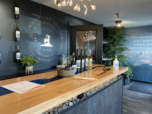 Photo of Glacier View Cellars - Woodinville, WA, US. a bar with bottles of wine