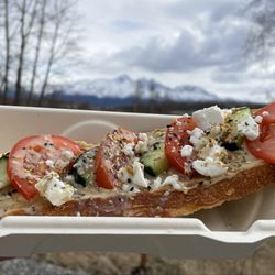 Focus Coffee - Greek toasty (Sunny Day Sourdough Co organic bread with hummus, cucumber, tomato, feta cheese, and tahini)
