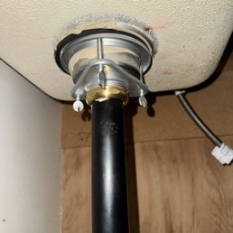 Under kitchen sink, replaced drain assembly and piping components to fix leak and improve seal.