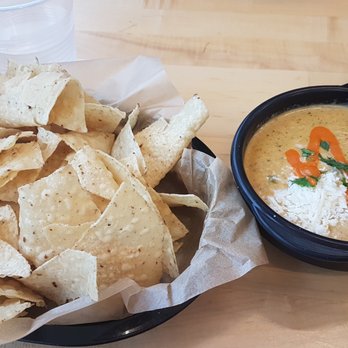 Torchy's Tacos - green chile queso dip and chips - Tacos Near Me - Austin, Texas Torchy's Tacos - green chile queso dip and chips - Tacos Near Me - Austin, Texas