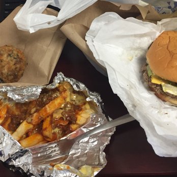 Tropical Express - a hamburger and fries on a table - Shaved Ice Near Me - Houston, Texas