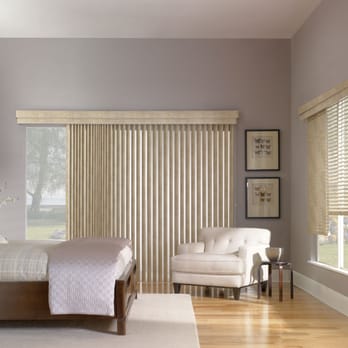 Budget Blinds - A mix of vertical and horizontal faux wood blinds feature a cordless wand and valance for full coverage. - Shades & Blinds Near Me