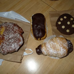 Treats from the Bakery: left to right: apple fritter, eclair, cream horn, double chocolate cookie Treats from the Bakery: left to right: apple fritter, eclair, cream horn, double chocolate cookie