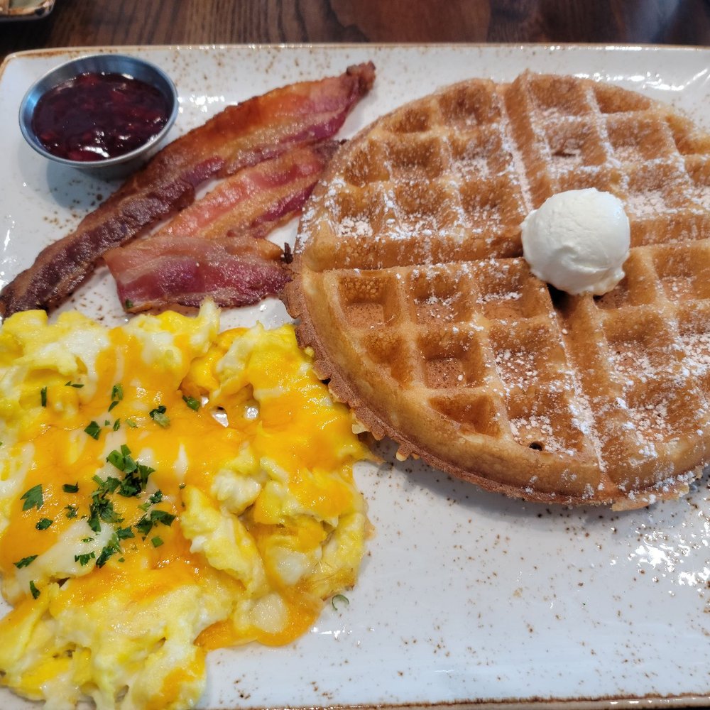 First Watch - Belgian  waffle scrambled eggs with cheese bacon  and berry compote - Breakfast & Brunch Near Me - Raleigh, North Carolina