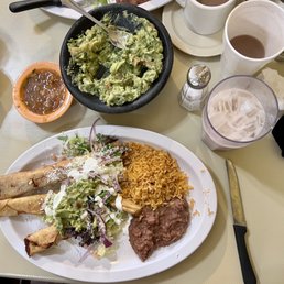 Taquitos de papa dish, guacamole, delicious horchata Taquitos de papa dish, guacamole, delicious horchata